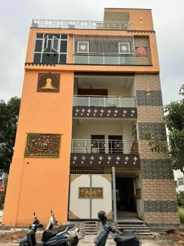 Three-storey terracotta and grey residence